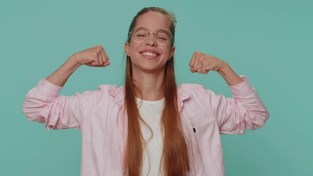 I am strong and independent. Pretty teenager young girl showing biceps and looking confident, feeling power strength to fight for rights, energy to gain success win. Fit sporty student child kid