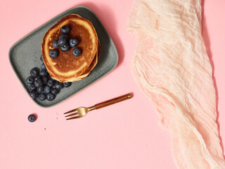 Breakfast Pancakes Isolated on Pink Background with Gold Fork