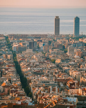 Cityscape view of Barcelona from Bunkers del Carmel at Sunrise with Eixample streets and view of the sea