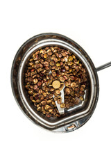 Whole dried unground sumac berries in a spice grinder top down