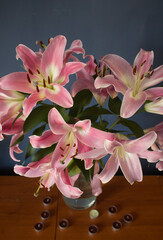 Beautiful bouquet of flowers. Lilies on a dark background. Background. Texture.
