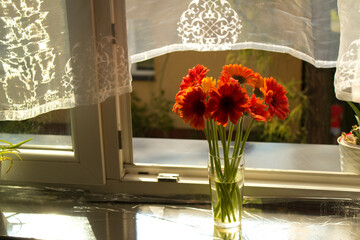 A beautiful bouquet of flowers on the window. Lilies on the window. Background. Texture.
