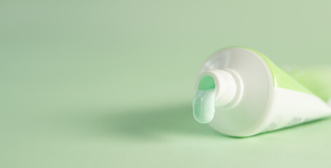 Tooth paste of mint on green background