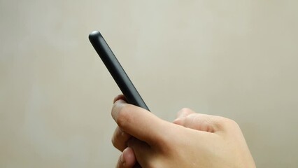 femele typing a message on a black phone closeup. High quality FullHD footage