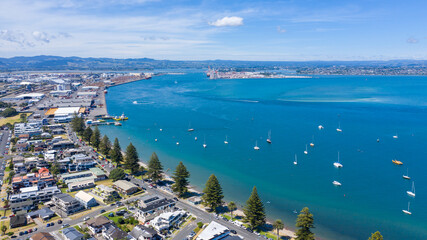 Aerial View from Houses close to the Beach, Green Trees, Mountain, Mount Maunganui, Boats in Tauranga, New Zealand - Bay of Plenty