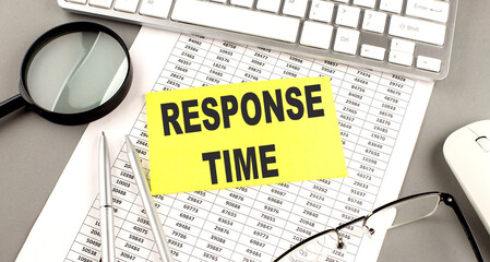 RESPONSE TIME text written on a sticky on chart with keyboard and magnifier