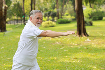 Asian senior man practice yoga excercise, tai chi tranining, stretching and meditation together...
