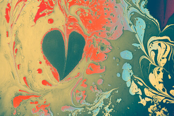 Abstract Ebru marbling painting background with with heart patterns