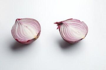 Two halves of a red onion on a white background