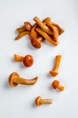 pickled chanterelle mushrooms on a white background