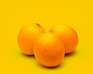 Oranges on yellow