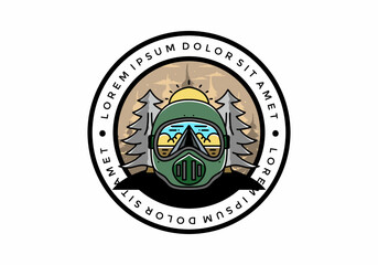 a trail helmet with a pine tree beside