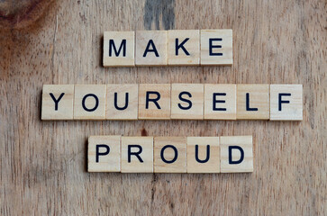 make yourself proud text on wooden square, motivation quotes