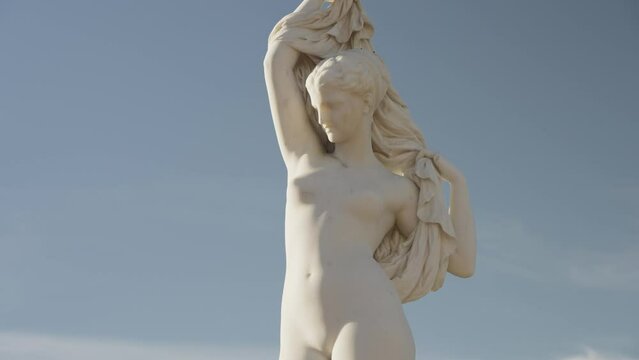 Statue of a naked woman posing