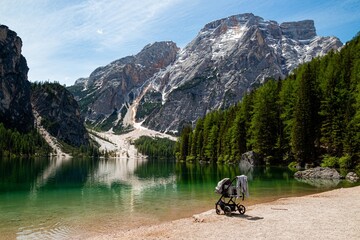 Lakeside hiking trail at iconic mountain lake Pragser Wildsee (Lago di Braies) in Dolomites, Unesco...