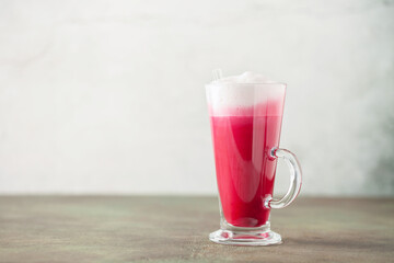 Vegetable drink. Healthy beetroot latte  on table. Copy space