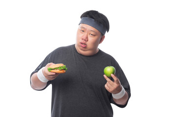 Young Asian funny fat sport man holding hamburger and green apple, Png file.