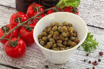 Marinated green capers in the bowl