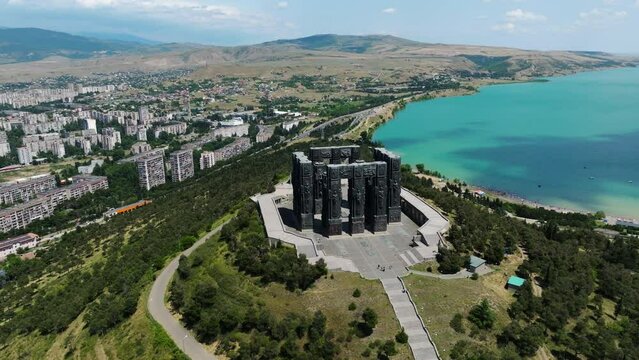 Aerial View Of The Monument Of Chronicles Of Georgia In Sakartvelo With Tbilisi Sea Lake - drone shot