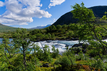 Jotunheimen National Park wild river with rapids of white water in Norway Europe
