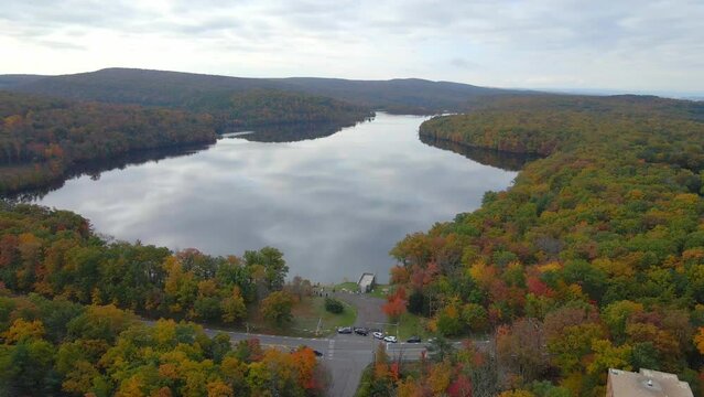 Aerial drone shot of a big lake in Wilkes barre Pennsylvania during the fall time.