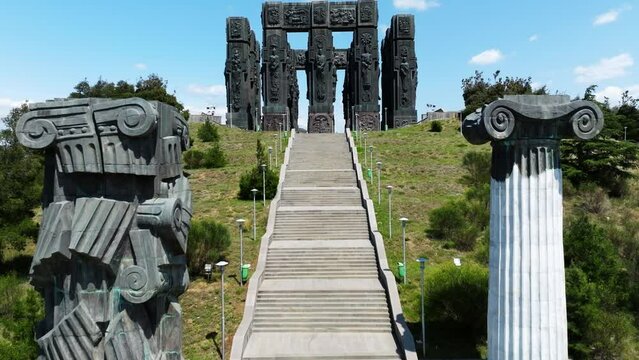 Flying Towards The Chronicle of Georgia Monument In Tbilisi, Georgia - aerial drone shot