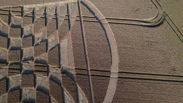 Aerial view from drone of Fake UFO circles on grain crop yellow field in Micheldever Station UK