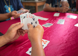 Set of poker cards in hand on the gambling table. Activity type gambling - 522666261