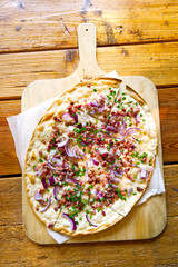 Flammkuchen “Tarte Flambée” traditional german food served with style - 522667890