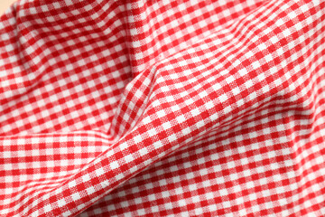 Red and white checkered tablecloth, close up