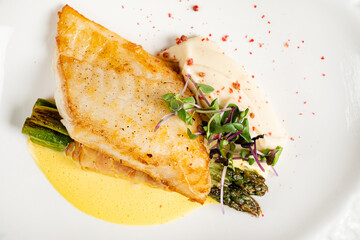 Halibut steak with vegetables and sauce