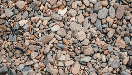 Close up of brown pebble stone or river stone background