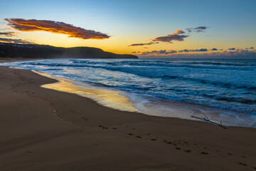 Fototapeta na wymiar Aerial sunrise at the beach with clouds