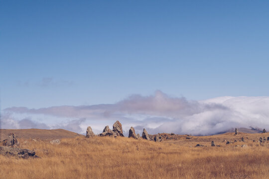 Megalithic standing stones and burial mound of Zorats Karer or Carahunge - prehistoric monument in Armenia. Armenian Stonehenge stock photography