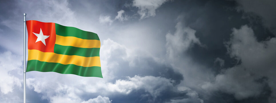 Togo flag on a cloudy sky