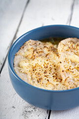 a bowl of hot French onion soup with mozzarella cheese and french bed on top
