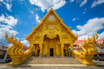The gold temple with a gold serpent has seven heads on both sides of the gold temple at Wat Sri...