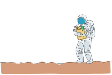 Single continuous line drawing of cosmonaut bring paper bag full of groceries on chest in moon surface. Galaxy astronaut farming life concept. Trendy one line draw graphic design vector illustration
