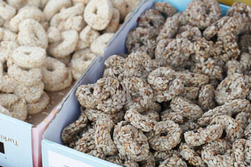 Traditional oriental sweet pastry cookies, nuts, dried fruits, pastilles, marmalade, Turkish desert with sugar, honey and pistachio, in display at a street food market