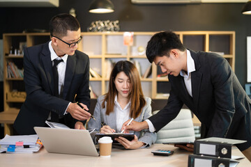  Young business creative team are brainstorming planning discussing while sitting in creative business discussing work in the modern office.