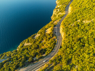 Winding coastal road at sunrise