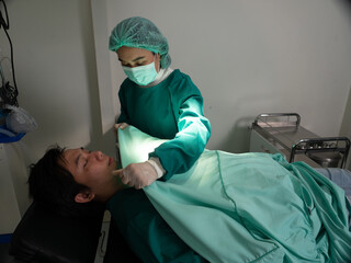 In hospital emergency room doctor shocking the heart use defibrillation but patient die not able to...