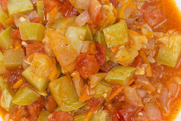 Vegetable marrow stewed with other vegetables close-up