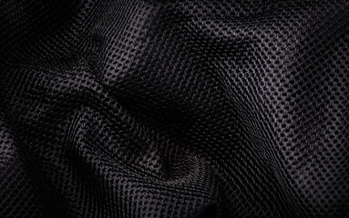 cloth, black background of closeup crumpled textile black color for background