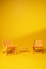 Beach chairs on yellow background. - Summer concept