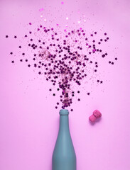  Creative concept food holiday Christmas photo with bottle of champagne and confetti.