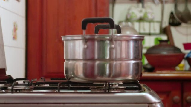 Making some Idiyappam, a traditional dish in Sri Lanka. Inside of a kitchen, making the traditional rice noodle dish.