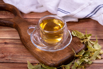Linden tea. Linden tea on wood floor. Herbal tea concept. Healthy drinks. close up
