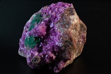 Cobalto calcite with malachite crystal macro on a black surface