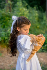 Girl with ginger cat. Beautiful portrait of girl with ginger cat in the hands.